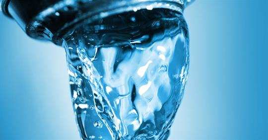 tap water coming out of faucet